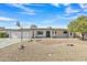 Inviting single-story home showcasing desert landscaping and a well-manicured front yard at 2424 E Fairfield St, Mesa, AZ 85213