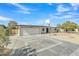 Charming home featuring a well-maintained exterior and a basketball hoop in the driveway at 2424 E Fairfield St, Mesa, AZ 85213