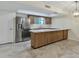 Modern kitchen area featuring ample counter space, wood cabinets, and stainless steel appliances at 2424 E Fairfield St, Mesa, AZ 85213