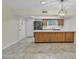 Bright kitchen features an island with modern countertops and stainless steel appliances at 2424 E Fairfield St, Mesa, AZ 85213