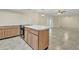 Open kitchen island has an oven and smooth surface cooktop for easy cooking and cleaning at 2424 E Fairfield St, Mesa, AZ 85213