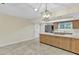 Bright kitchen features an island with modern countertops and a stainless steel refrigerator at 2424 E Fairfield St, Mesa, AZ 85213