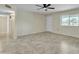 Open-concept living space with tile floors and a view of the front and backyard at 2424 E Fairfield St, Mesa, AZ 85213