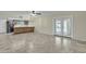 Large open area showcasing kitchen with wood cabinets and access to the patio at 2424 E Fairfield St, Mesa, AZ 85213
