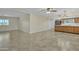 Great layout featuring an open area, kitchen with bar seating, and sleek tile flooring at 2424 E Fairfield St, Mesa, AZ 85213