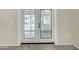 Stylish patio door leading to outdoor space with neutral walls and tiled flooring indoors at 2424 E Fairfield St, Mesa, AZ 85213