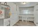 Utility room including water heater and shelving at 2424 E Fairfield St, Mesa, AZ 85213
