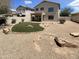Large backyard featuring rocks and artificial turf at 25038 N 40Th Ave, Phoenix, AZ 85083