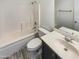Well-lit bathroom with a tub and shower combination, single sink vanity, and gray tile flooring at 25038 N 40Th Ave, Phoenix, AZ 85083