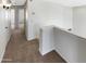 Carpeted hallway leading to rooms with neutral walls and lighting fixtures at 25038 N 40Th Ave, Phoenix, AZ 85083