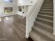 Living room featuring stairs and hardwood floor at 25038 N 40Th Ave, Phoenix, AZ 85083