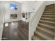 Bright living room featuring stairs and hardwood floor at 25038 N 40Th Ave, Phoenix, AZ 85083