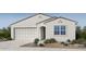 Charming single-story home showcasing a well-manicured front yard and a convenient two-car garage at 25177 N 167Th Ave, Surprise, AZ 85387