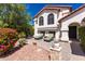 Inviting backyard featuring a stone patio with outdoor seating at 2630 E Dolphin Ave, Mesa, AZ 85204