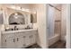 Well-lit bathroom featuring a double sink vanity, framed mirrors, and a shower-tub combination at 2630 E Dolphin Ave, Mesa, AZ 85204