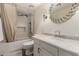 Updated bathroom with a shower-tub combo and stylish vanity at 2630 E Dolphin Ave, Mesa, AZ 85204