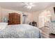 Spacious bedroom featuring a bed, wardrobe, vanity area and an ensuite bathroom at 2630 E Dolphin Ave, Mesa, AZ 85204