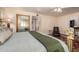 Serene bedroom featuring a large mirror, soft lighting, and calming color palette at 2630 E Dolphin Ave, Mesa, AZ 85204