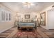 Comfortable bedroom with a gold frame bed, shuttered windows, and neutral decor at 2630 E Dolphin Ave, Mesa, AZ 85204