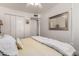 Bright bedroom with closet, full-length mirror and a four-poster bed with yellow linens at 2630 E Dolphin Ave, Mesa, AZ 85204
