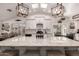 Spacious white kitchen with large marble island and decorative pendant lighting at 2630 E Dolphin Ave, Mesa, AZ 85204