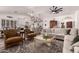 Inviting living room with stylish seating, wood floors, and an open layout at 2630 E Dolphin Ave, Mesa, AZ 85204
