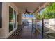 Covered patio offering a shaded retreat overlooking the pool and backyard, perfect for relaxation at 2630 E Dolphin Ave, Mesa, AZ 85204
