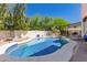 Beautiful backyard pool with well-maintained landscaping, and ample patio space for outdoor enjoyment at 2630 E Dolphin Ave, Mesa, AZ 85204