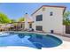 Backyard featuring a sparkling pool with a spacious patio, perfect for outdoor relaxation and entertainment at 2630 E Dolphin Ave, Mesa, AZ 85204