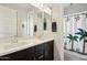 Bright bathroom boasts a dual sink vanity and shower with whimsical monkey-themed curtain at 2942 E Appaloosa Rd, Gilbert, AZ 85296