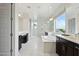 Spacious bathroom with a soaking tub, marble floors, dual vanities, and a large shower at 2942 E Appaloosa Rd, Gilbert, AZ 85296