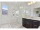 Modern bathroom featuring a glass-enclosed shower, neutral vanity, and sleek fixtures at 2942 E Appaloosa Rd, Gilbert, AZ 85296