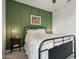 Serene bedroom features an accent wall, modern sconces, and cozy bedding at 2942 E Appaloosa Rd, Gilbert, AZ 85296