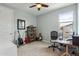 Comfortable bedroom with guitars, a bookshelf, and a dedicated workspace at 2942 E Appaloosa Rd, Gilbert, AZ 85296