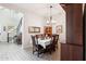 Cozy dining room with modern lighting and ample seating for Gathering gatherings at 2942 E Appaloosa Rd, Gilbert, AZ 85296
