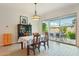 Bright dining area featuring a modern chandelier and sliding glass doors to the backyard patio at 2942 E Appaloosa Rd, Gilbert, AZ 85296