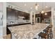 Spacious kitchen features granite countertops, dark cabinetry, and stainless steel appliances at 2942 E Appaloosa Rd, Gilbert, AZ 85296