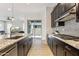 Kitchen showcases granite countertops, stainless steel appliances, and dark cabinets at 2942 E Appaloosa Rd, Gilbert, AZ 85296