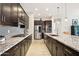 Open kitchen design with a large island, stainless steel appliances, and stylish backsplash at 2942 E Appaloosa Rd, Gilbert, AZ 85296