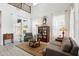 Bright living room featuring vaulted ceilings, large windows, and stylish decor at 2942 E Appaloosa Rd, Gilbert, AZ 85296