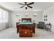 Large bedroom showcasing a wooden bed, a vintage chair, and plenty of natural light at 2942 E Appaloosa Rd, Gilbert, AZ 85296