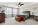 Spacious main bedroom with a wooden bed, large windows, and comfortable decor at 2942 E Appaloosa Rd, Gilbert, AZ 85296