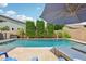 Private backyard pool with lounge chairs, clear blue water, surrounded by tall privacy hedges at 2942 E Appaloosa Rd, Gilbert, AZ 85296