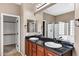 Bright bathroom boasts dual sinks, granite counters, and a walk-in shower at 3033 W Redwood Ln, Phoenix, AZ 85045