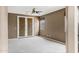 Bedroom with dark tan walls, carpet, and bamboo shade doors at 3033 W Redwood Ln, Phoenix, AZ 85045