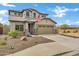 Charming two-story home featuring a tile roof, desert landscaping, and a two car garage at 3033 W Redwood Ln, Phoenix, AZ 85045