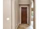 Inviting foyer with tile flooring, showcasing a dark wood door and light-colored walls at 3033 W Redwood Ln, Phoenix, AZ 85045