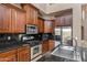 Kitchen features stainless appliances and dark granite counters at 3033 W Redwood Ln, Phoenix, AZ 85045