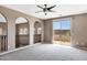 Spacious upstairs living room with carpet, ceiling fan, and sliding glass doors at 3033 W Redwood Ln, Phoenix, AZ 85045