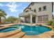 Backyard features a large, modern pool and spa with a grill and patio area at 3033 W Redwood Ln, Phoenix, AZ 85045